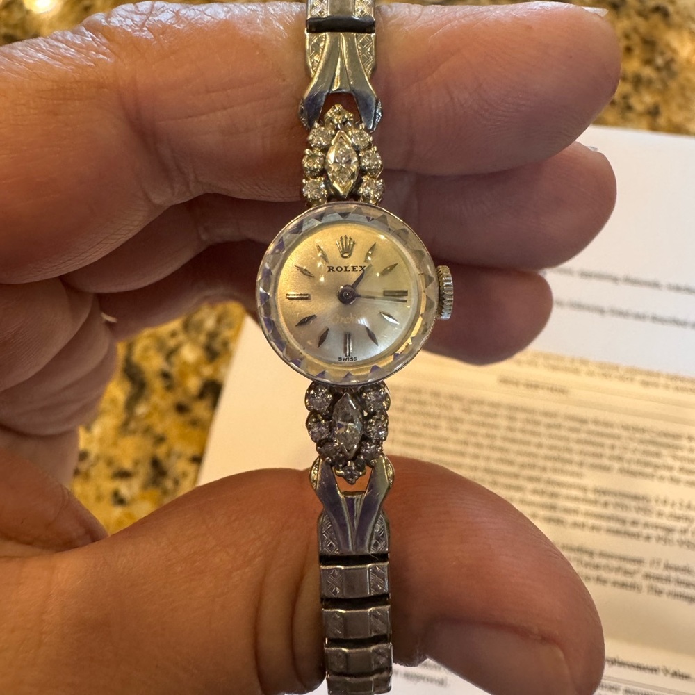 Rolex Silver Vintage-Style Watch with Intricate Design
